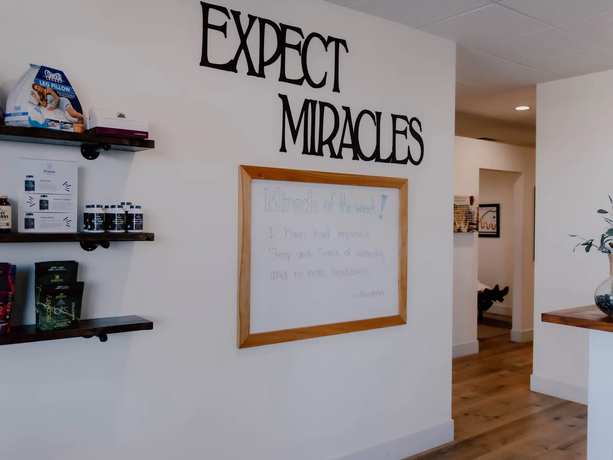 The miracle of the week board by the front desk, carrying a patient's note
